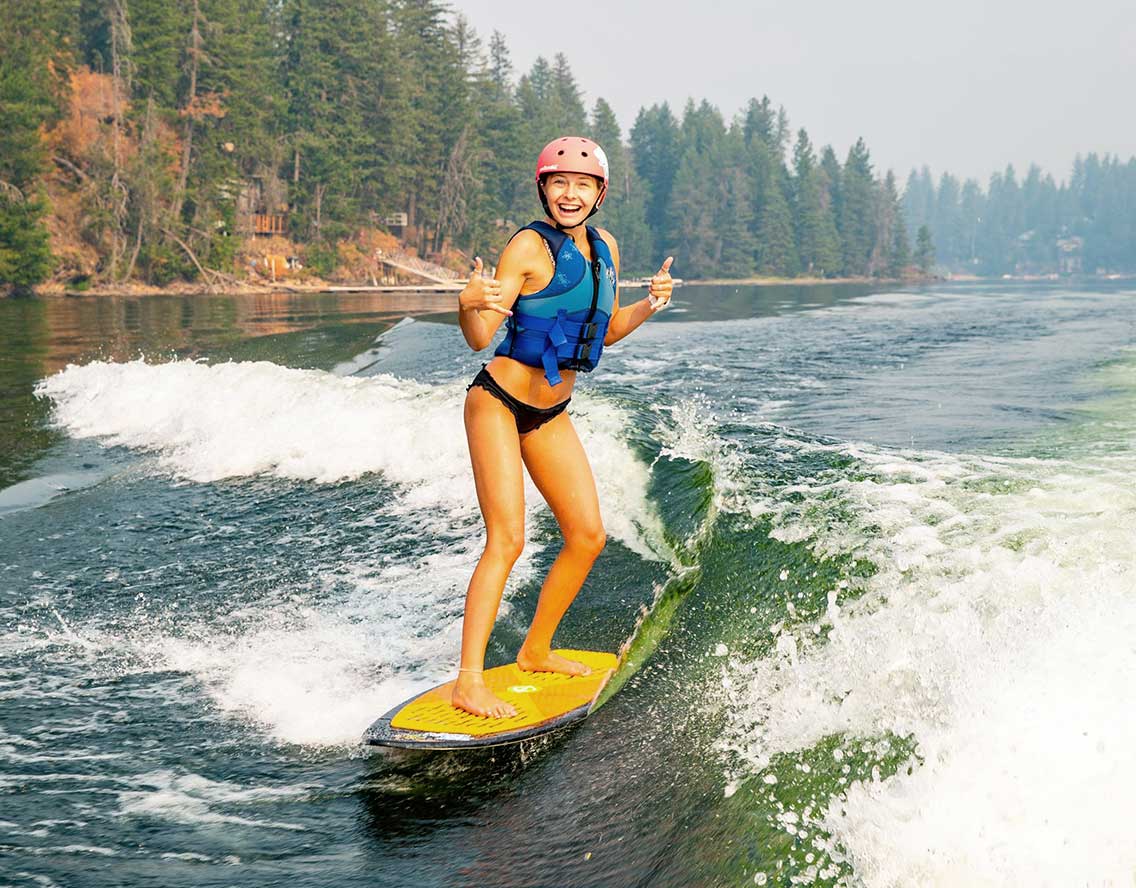 HighSchoolWaterSportsPhoto1_2021 High school campera surfing behind Supra Wakeboard Boat