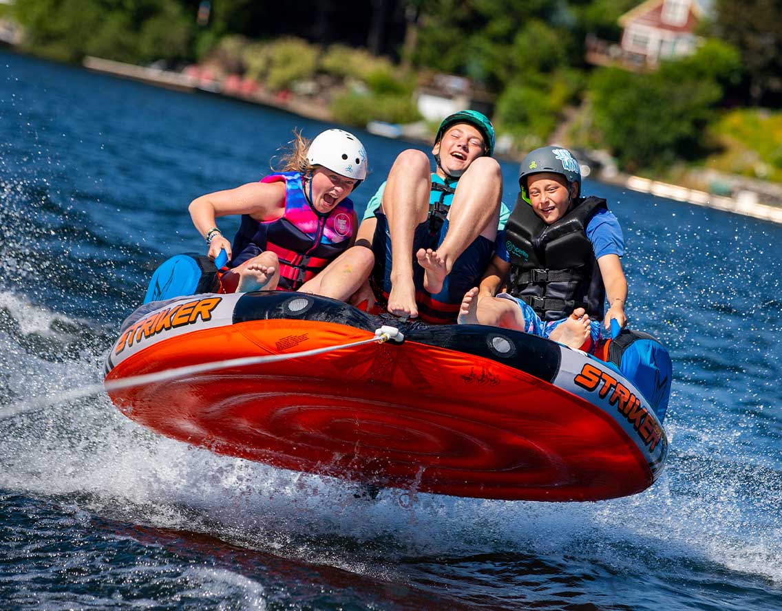 Twinlow Summer Kids Camp Middle School Watersports tubing on the lake